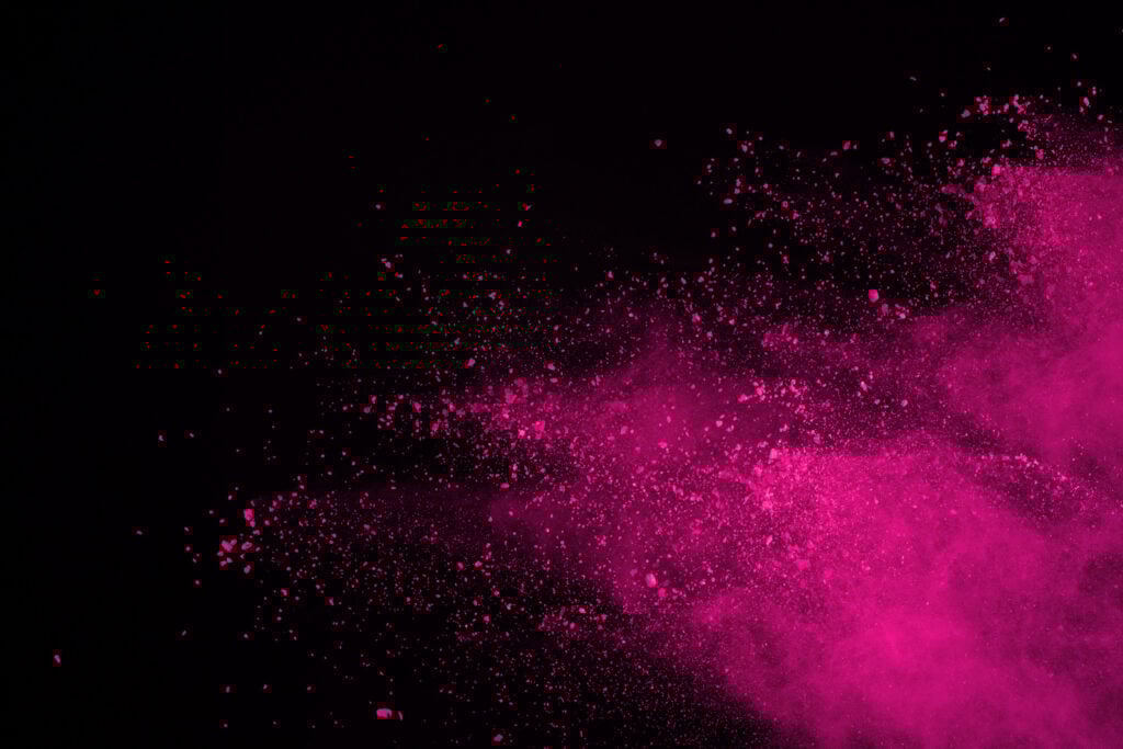 Pink color explosion on black background