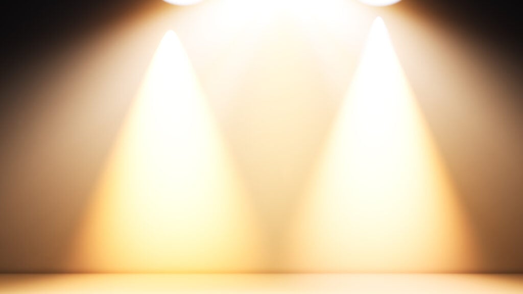 Yellow spotlights on neutral background