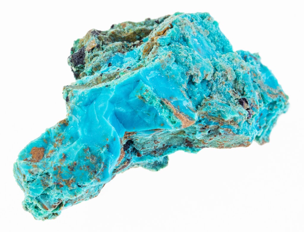 Macro shot of raw chrysocolla stone on a white background