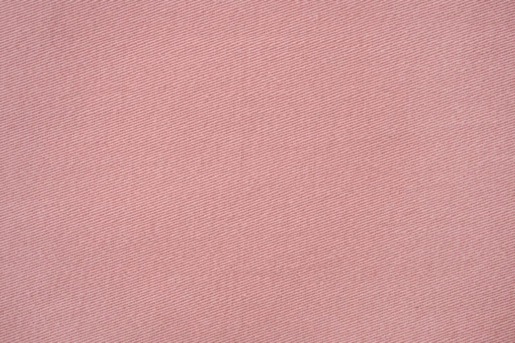 Closeup of pink denim texture