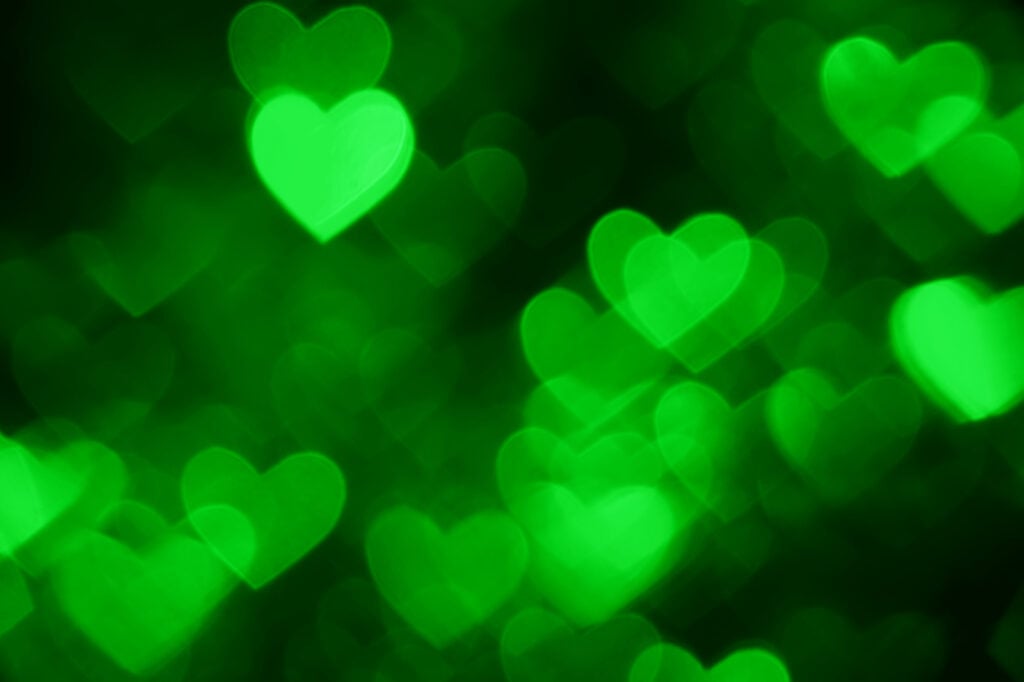 Green hearts on a black background.