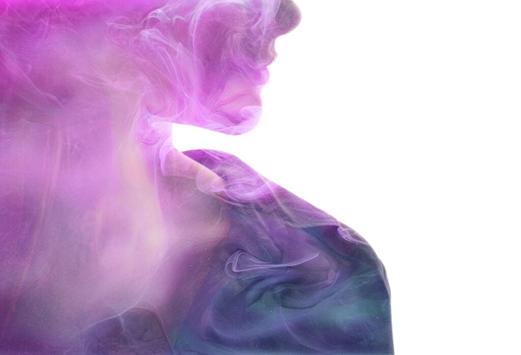 Profile of a woman's face with magenta aura color surrounding her.