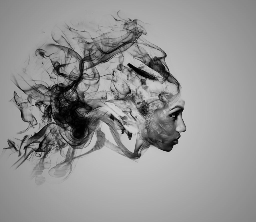 Profile picture of a head with smoky swirls illustrating the black aura.