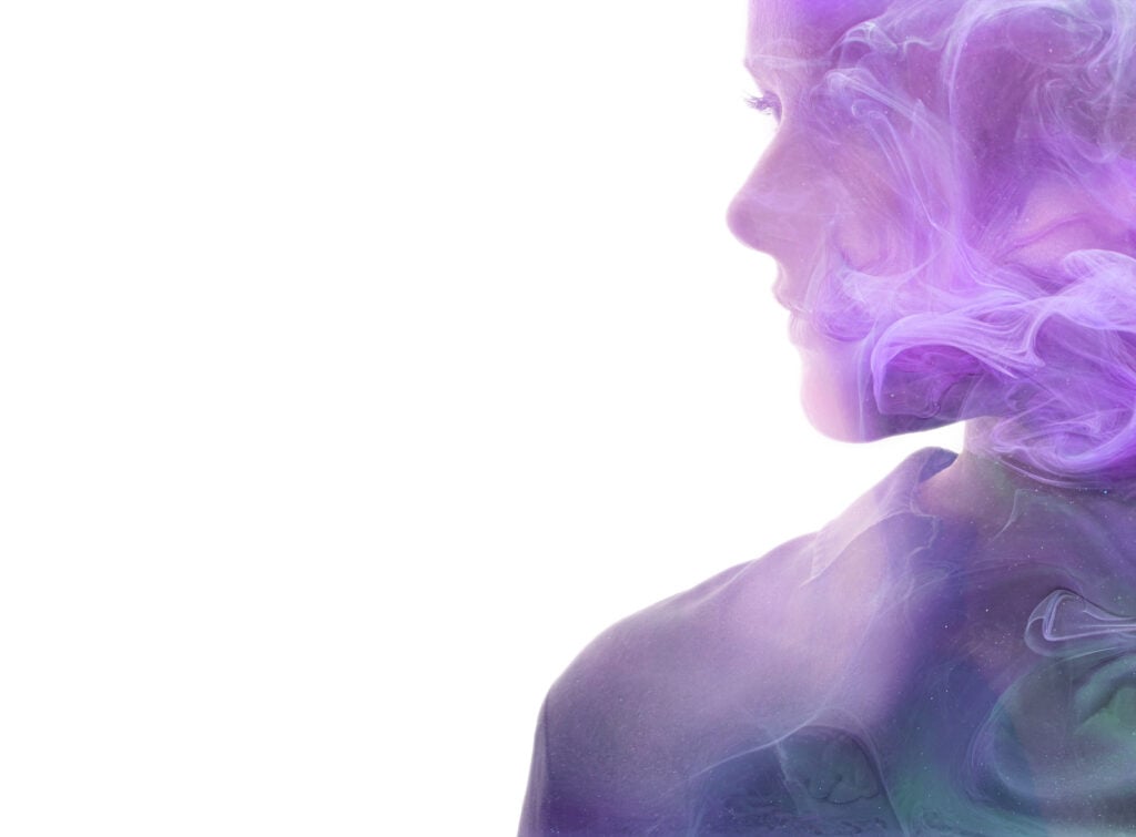 Profile of a woman with swirls of purple smoke surrounding her illustrating the purple aura.