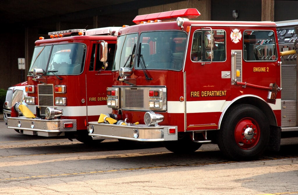 Red fire trucks parked next to each other