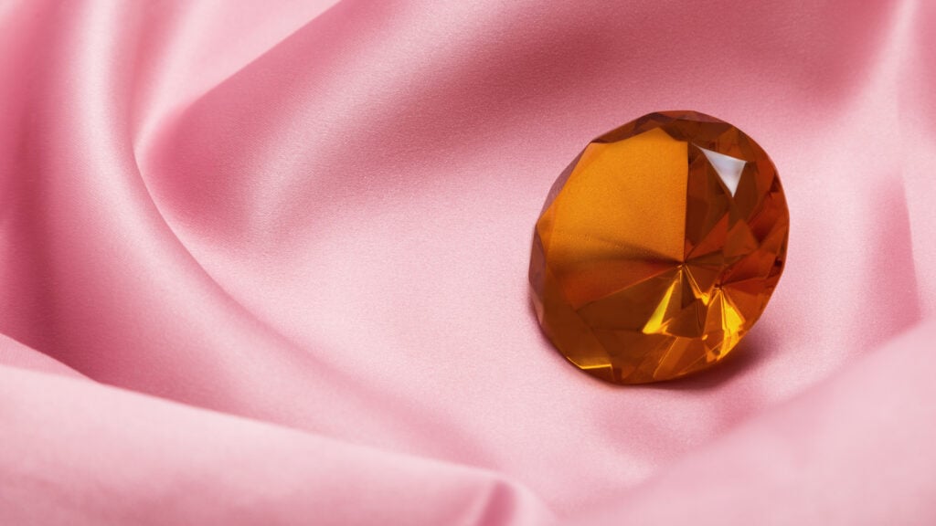 Brown diamond on pink fabric