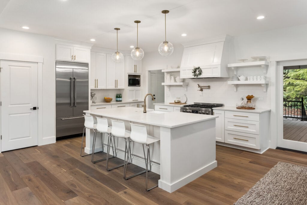 White kitchen design with dark wooden floors