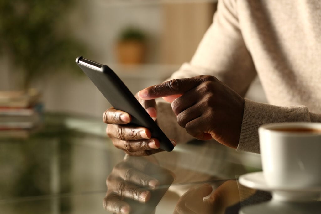 Person using a black cell phone