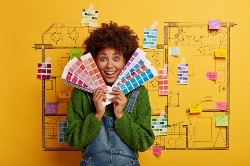 Woman choosing color palettes for home interior decorating project