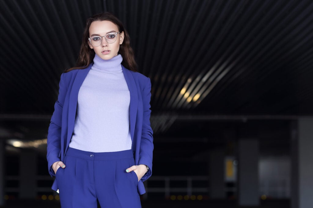 Woman in indigo and purple outfit