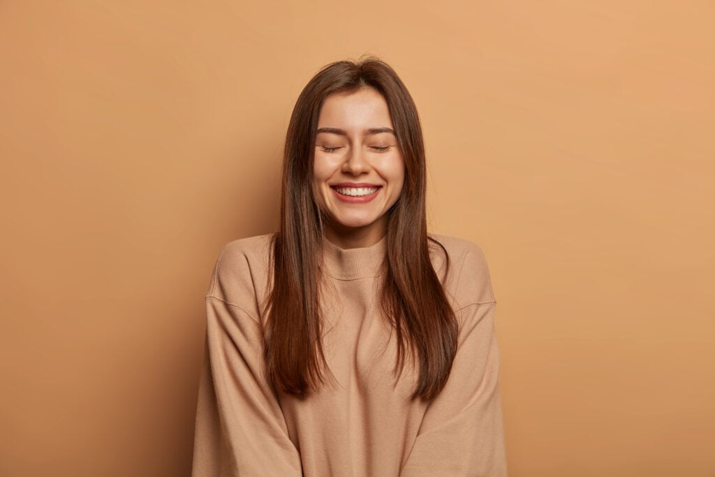 Smiling woman wearing brown