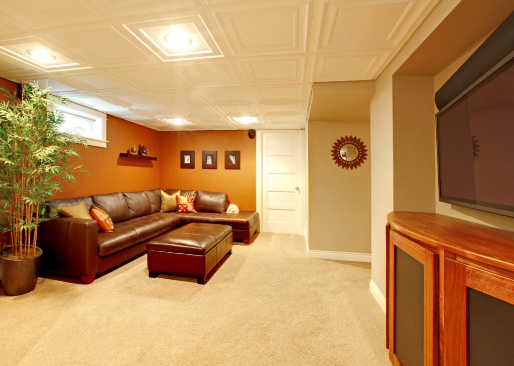 Basement living room with caramel walls.