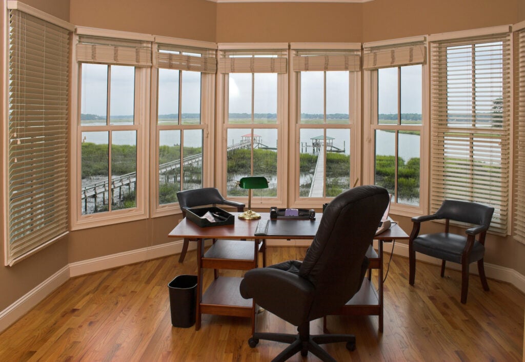 Home office with sand-colored walls.