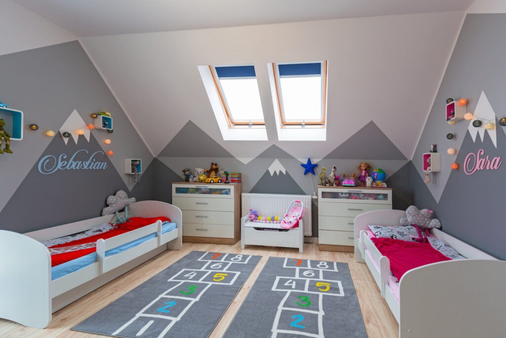 Modern bedroom for boy and girl with charcoal gray mountains painted on walls.