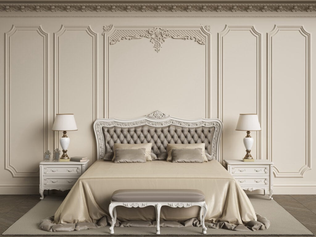 Classic bedroom with cream walls and cream furniture.