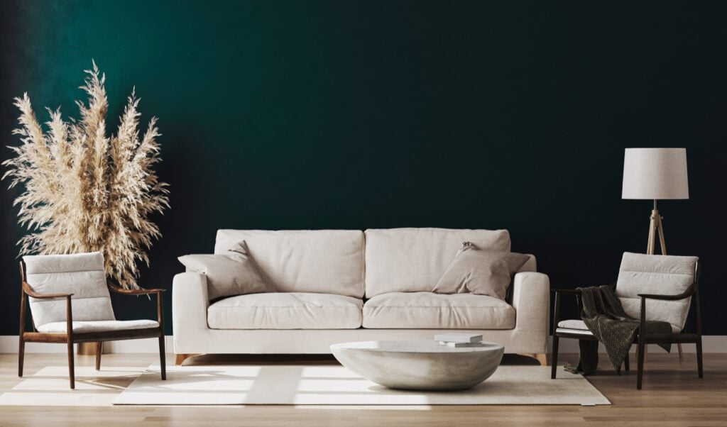 Modern interior of living room with hunter green wall.