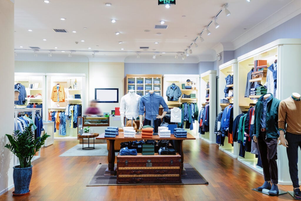 Interior of casual clothing store with colorful walls and inventory