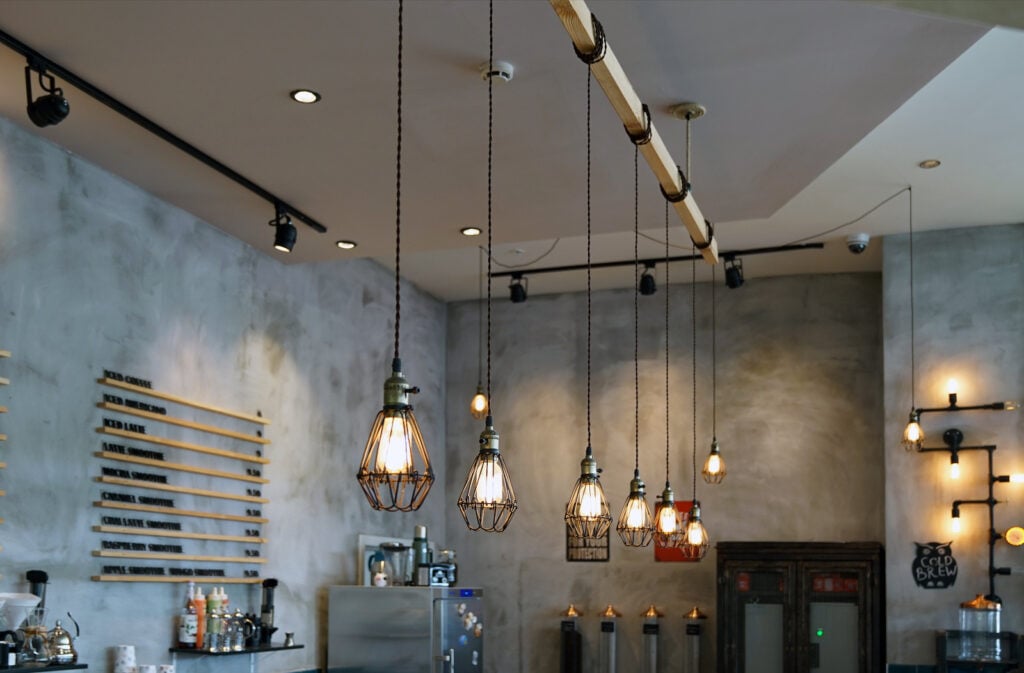 Interior of bar or coffee shop with patterned gray-green walls