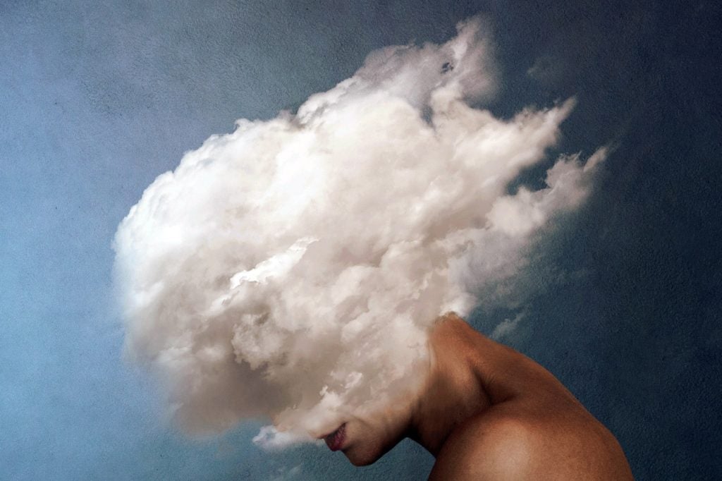 An image of a woman with a white cloud for a face