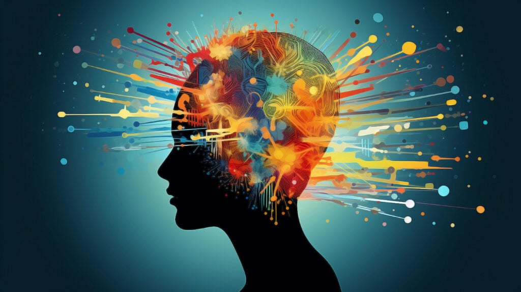 An abstract image of a silhouette of a human head with a burst of color radiating from it