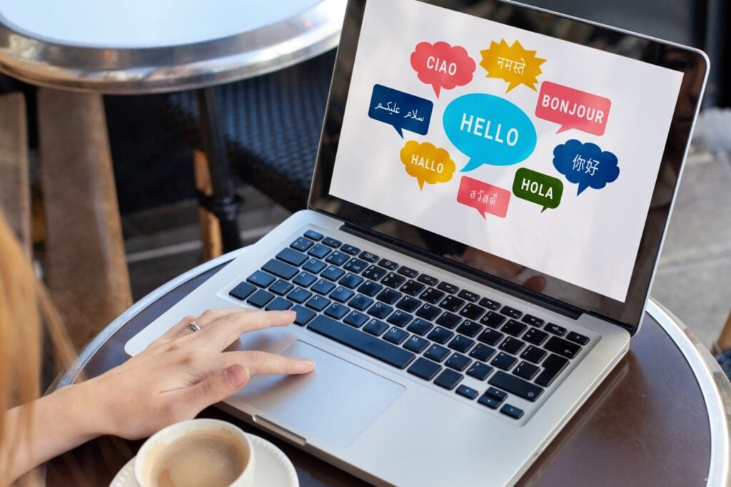 person looking at different colored words on laptop