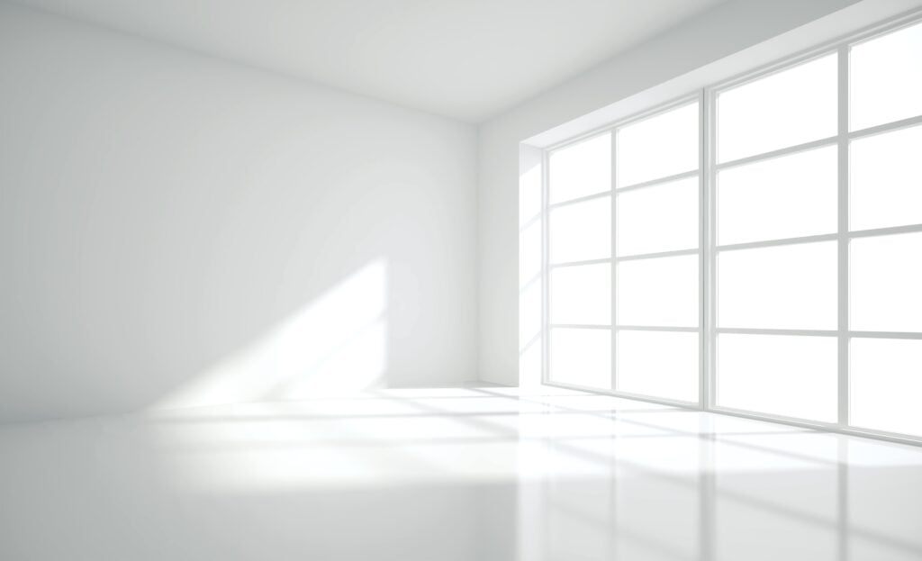 Empty white room with large window