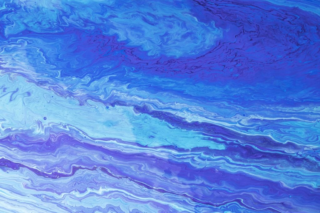 Blue-purple paint waves in different shades