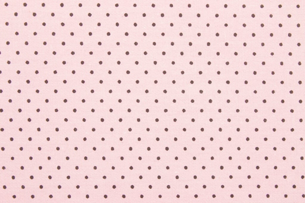 Brown dots on pink background