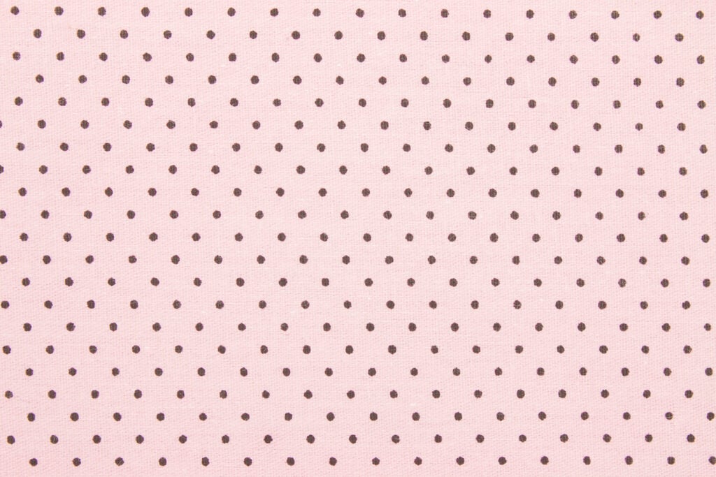 Brown dots on pink background