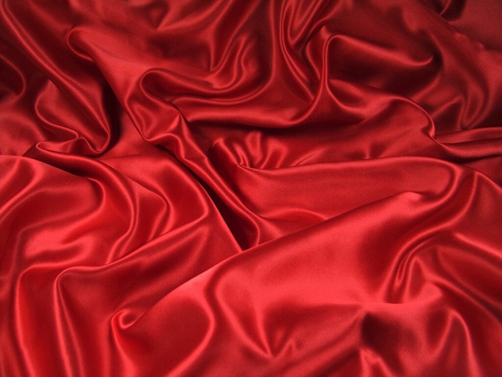 Bright red wavy satin fabric