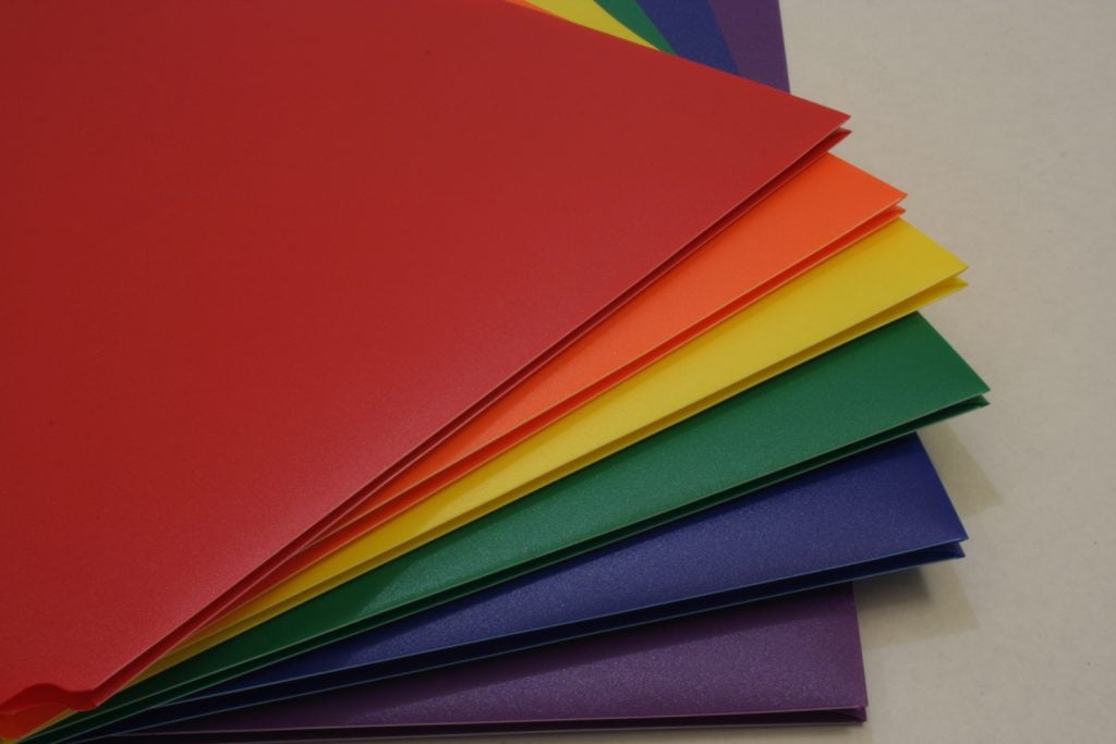 Folders in different colors for the school subjects math, English, social studies, and science