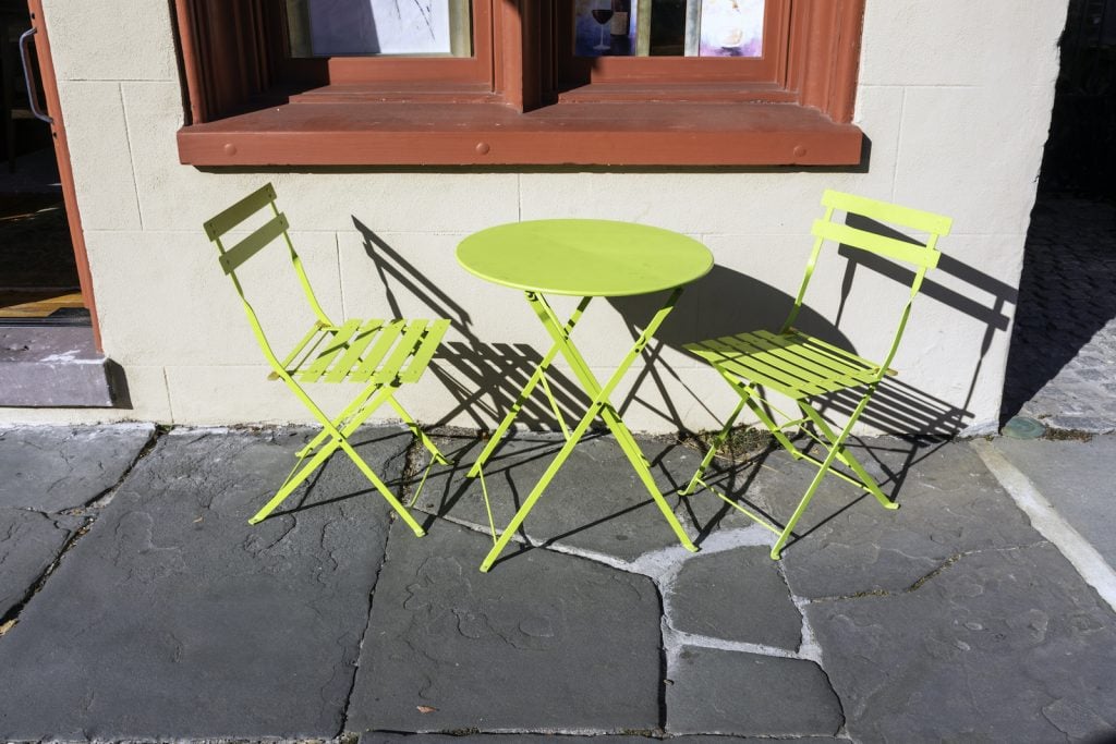 Yellow-green patio furniture outside building