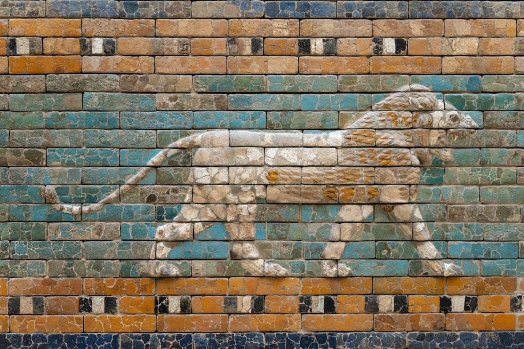 Walking lion relief on green glazed ceramic wall from ancient Babylon Mesopotamia