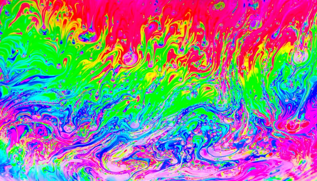 Background with rainbow colors created by soap bubbles