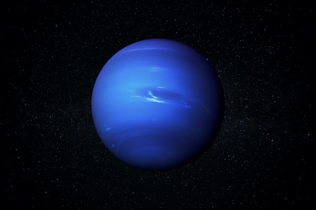 The blue planet Neptune in a starry sky of the solar system in space