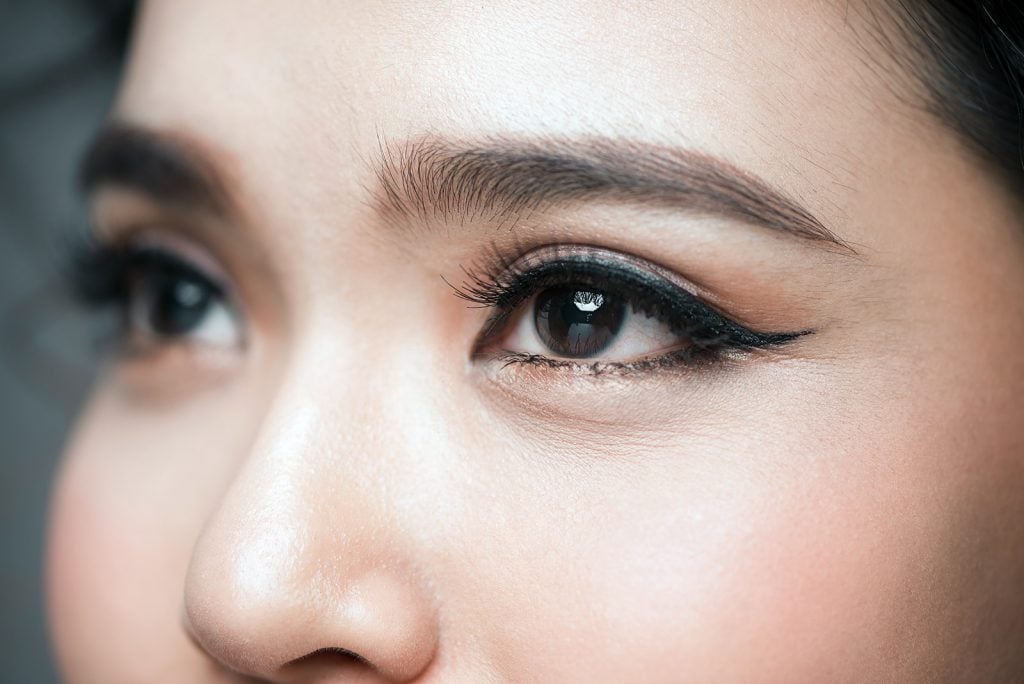 Close-up of Asian woman with very dark brown almost black eyes