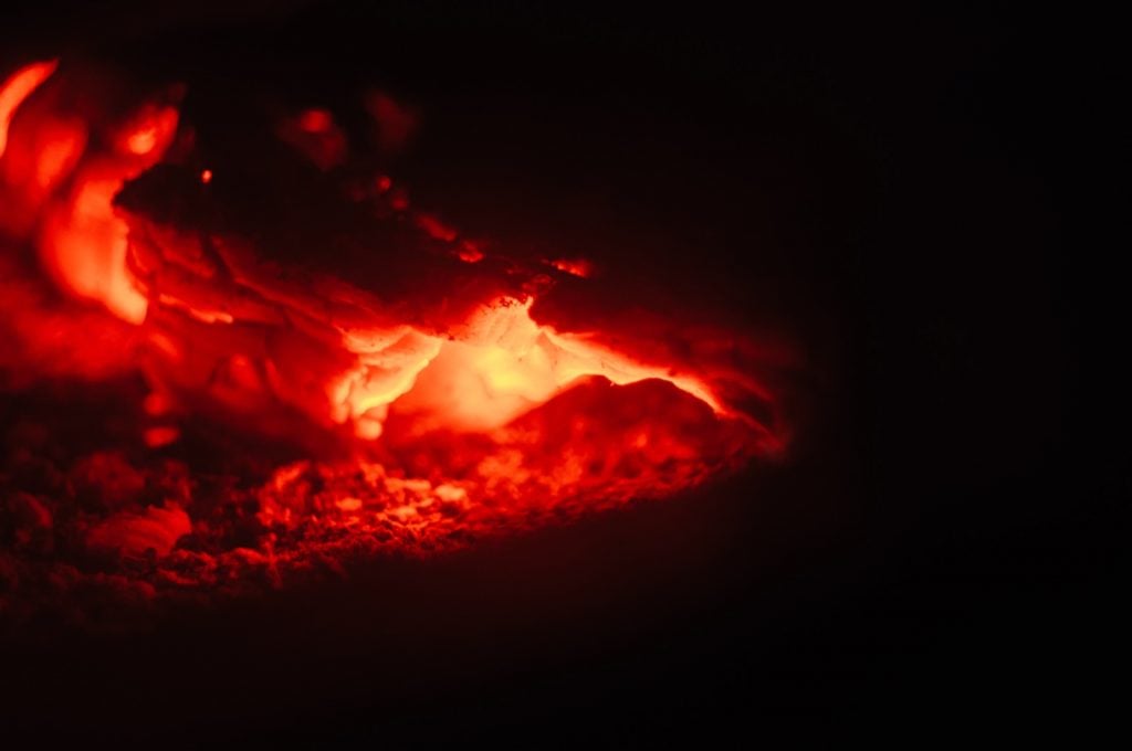Closeup shot of red fire on a black background