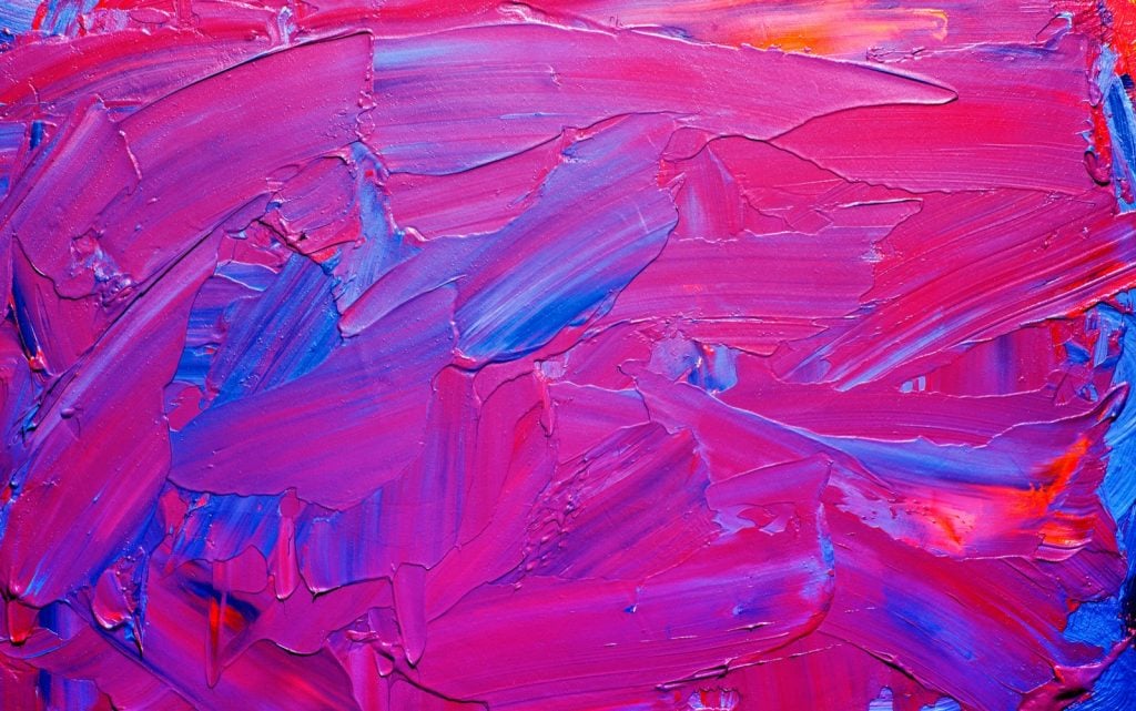 Creating purple paint by mixing red and blue colors