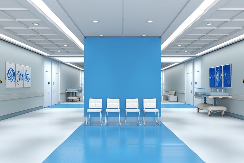 Hospital with blue colored walls and calming pictures in dark blue colors