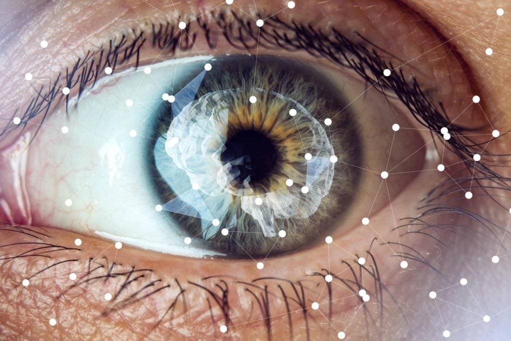 Human eye with an image of a brain in the middle of the pupil and iris
