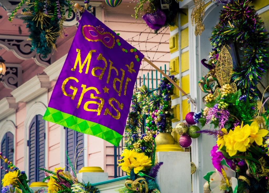 Mardi Gras decorations in New Orleans with colorful flag