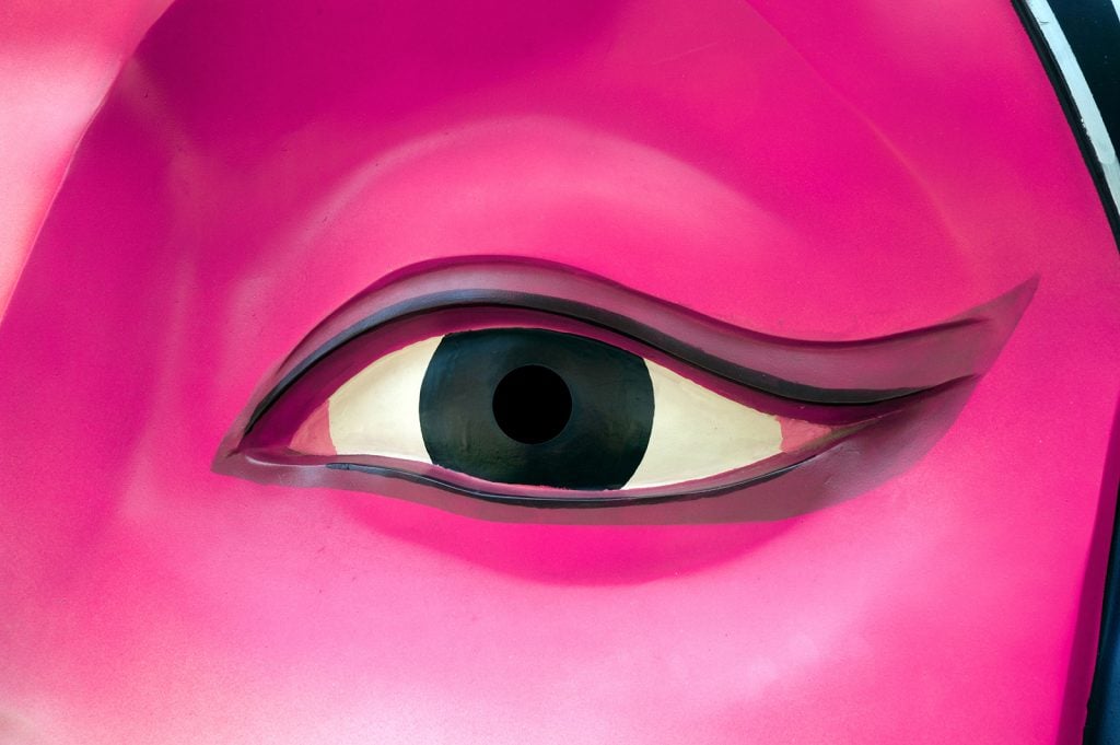 Pink Chinese opera mask close up