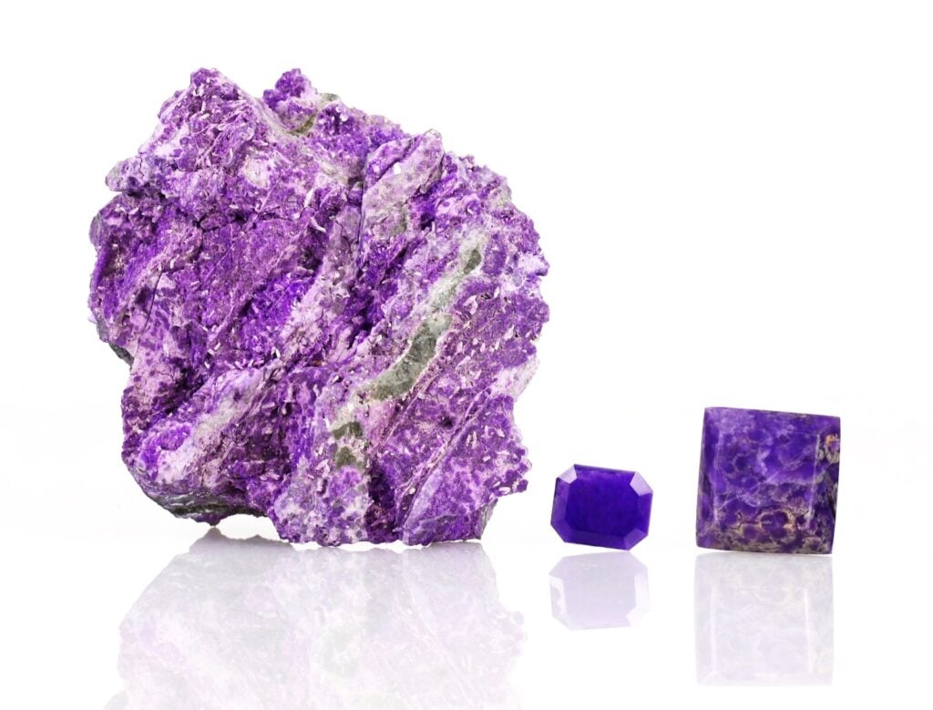 Rare purple sugilite mineral stones isolated on white background