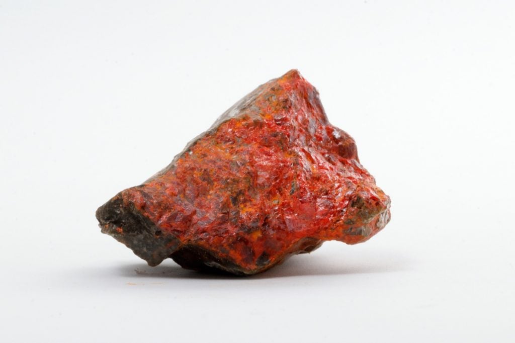 Realgar mineral on stone used to create orange pigment in ancient Mesopotamia
