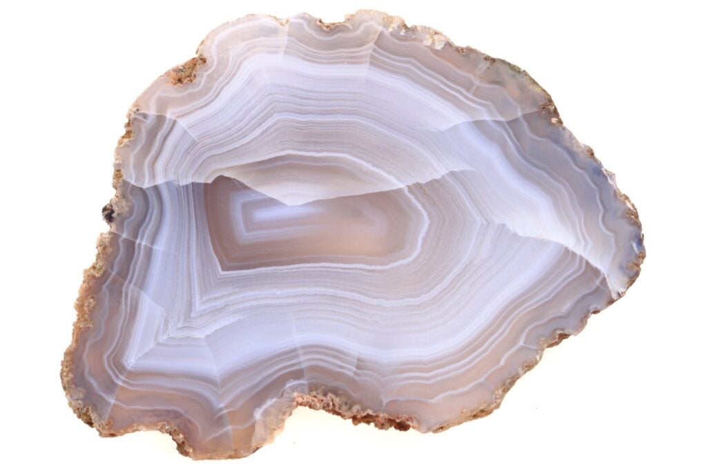 Slice of white agate stone isolated