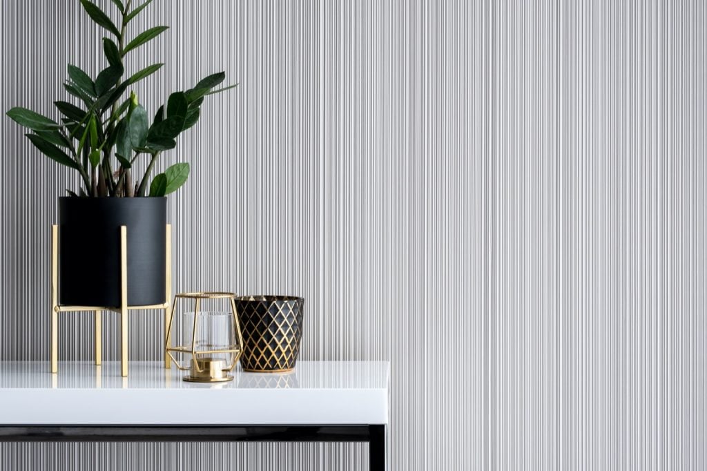 Stylish decoration in gold and black on white, high gloss console table